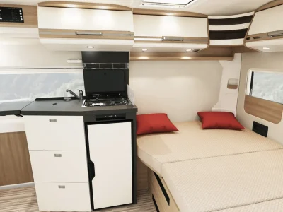 Malibu Compact Schlafbereich mit Küche und zwei roten Kissen